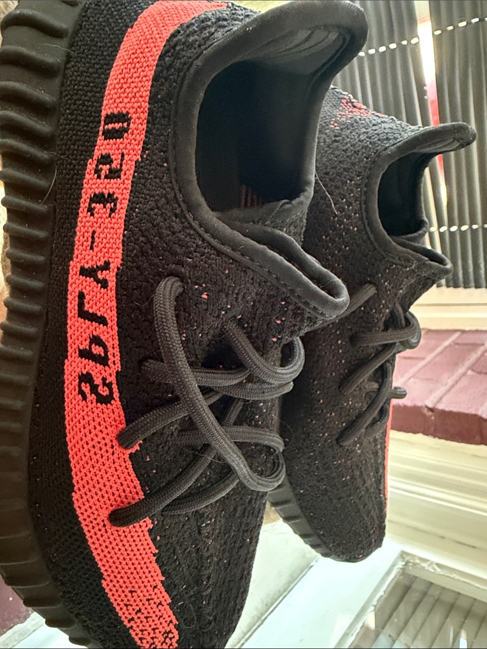 Yeezy Kids Black Sneakers with Bright Red Stripe